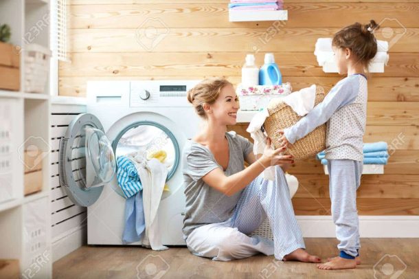 Happy Family Mother Housewife And Child Daughter In Laundry With.. Stock  Photo, Picture And Royalty Free Image. Image 85134854.