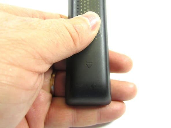To open the Samsung Smart TV Remote, flip the remote over and slide the back cover down in the direction on the indicators.